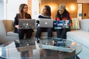 Latina Woman  engineer mentoring young women of color developers